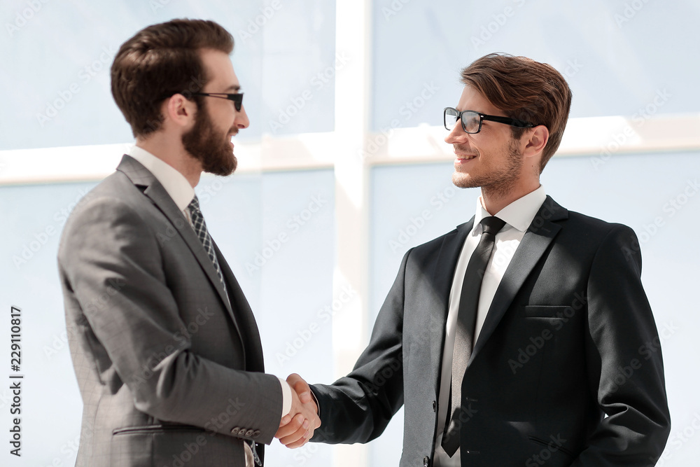 two business people shaking hands two business people shaking hands