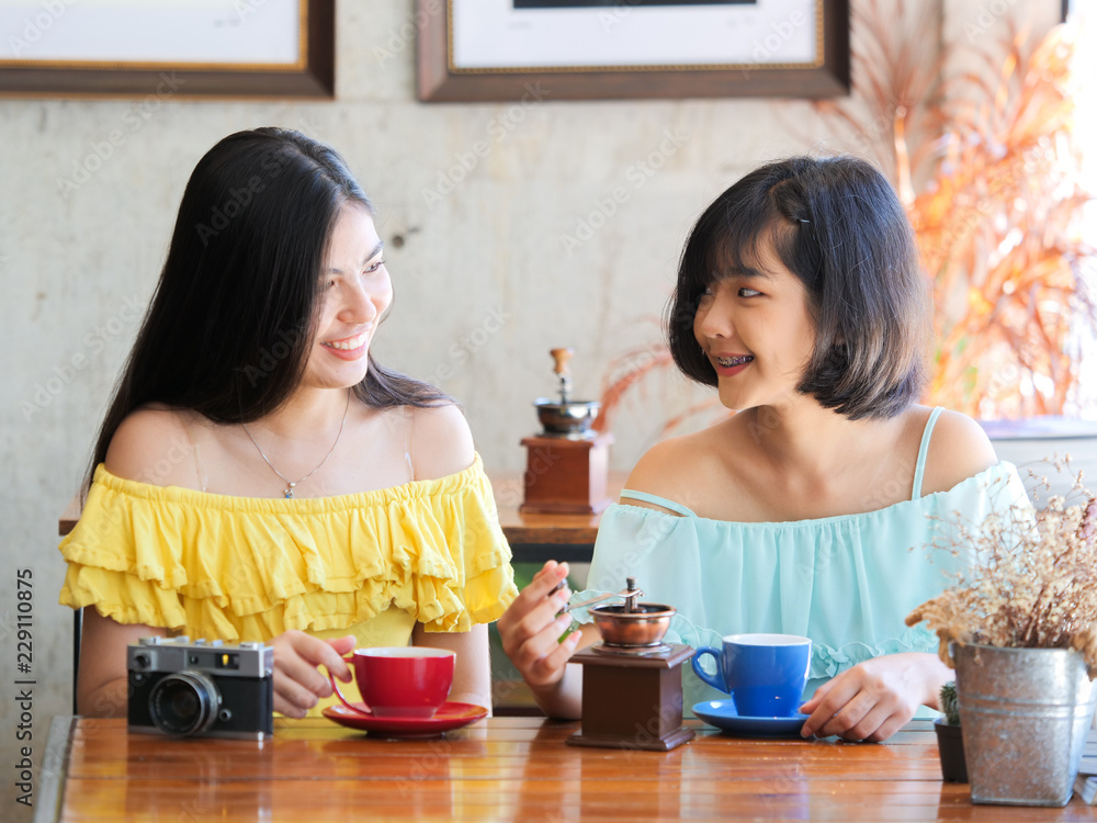 Asian woman drinking coffee and relax in coffee shop cafe Asian woman drinking coffee and relax in coffee shop cafe