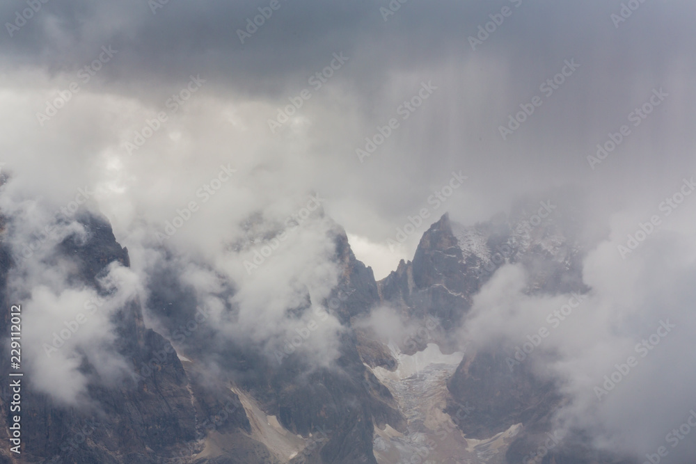 Beautiful summer scenery in the Dolomite Alps, Italy, with dramatic storm clouds