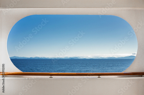 East view across Queen Charlotte Sound, BC, Canada through crusie ship window.