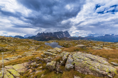 Beautiful summer scenery in the Dolomite Alps, Italy, with dramatic storm clouds