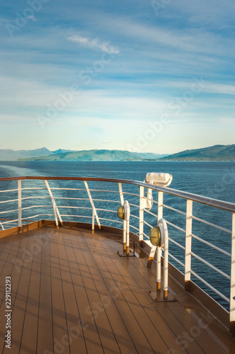 Exterior white metal light fixture and railing, port side on a cruise ship. photo