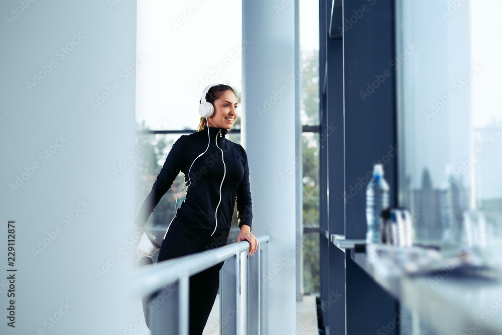 Woman is stretching before jogging. Fitness and lifestyle concept. Woman is stretching before jogging. Fitness and lifestyle concept.