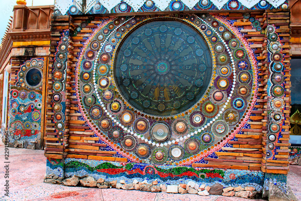 Beautiful mosaic mandalas on the walls of the main building at wat Prathat, Pha Sorn Kaew, in Khao Kor, Phetchabun, Thailand