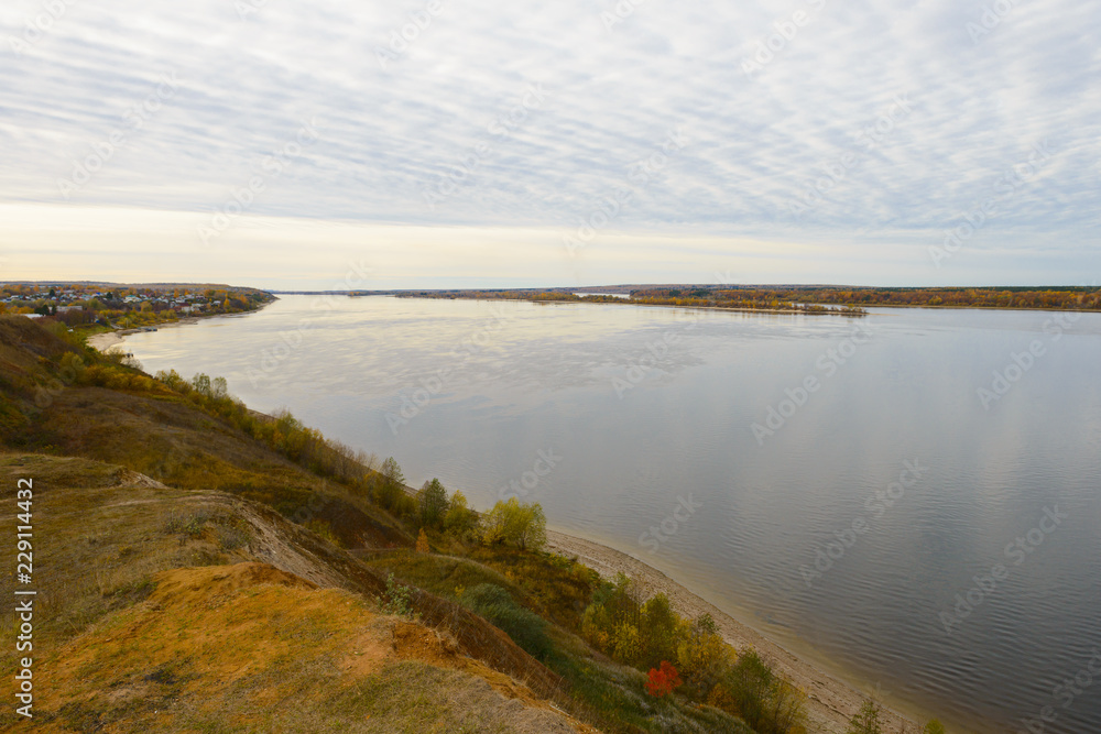 The Volga River on a cloudy autumn day. View from the high bank.