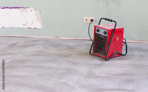 Fototapeta Compact red heater, drying the floor