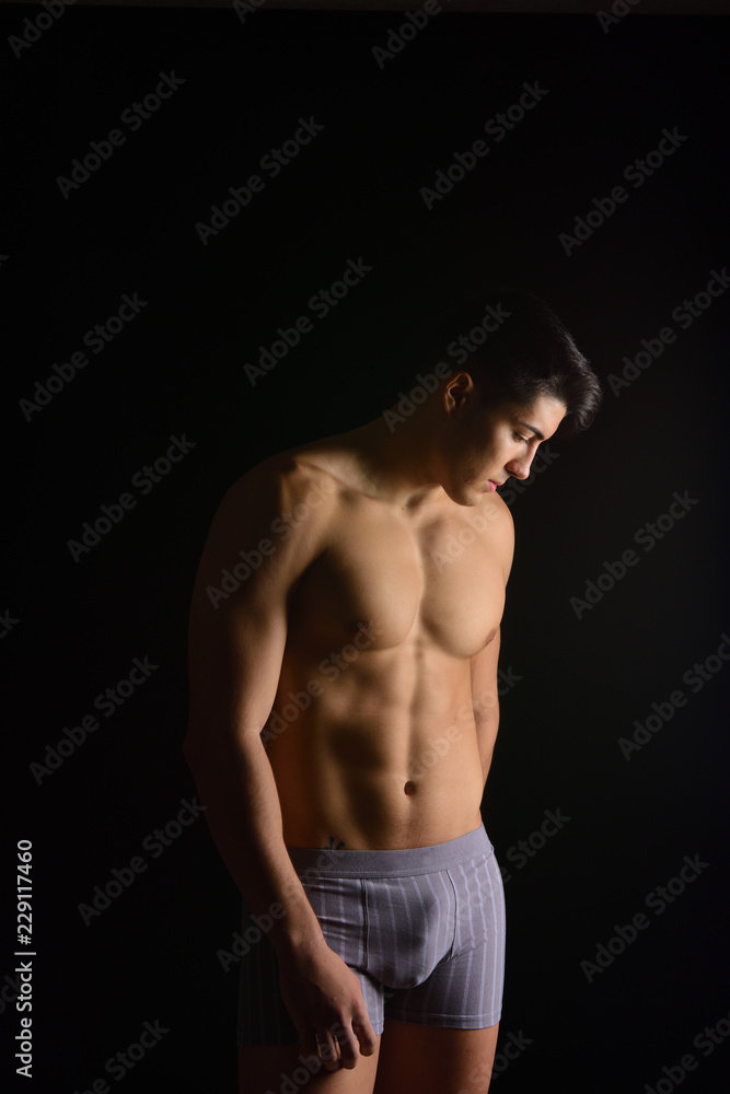 portrait of a man without clothes black background