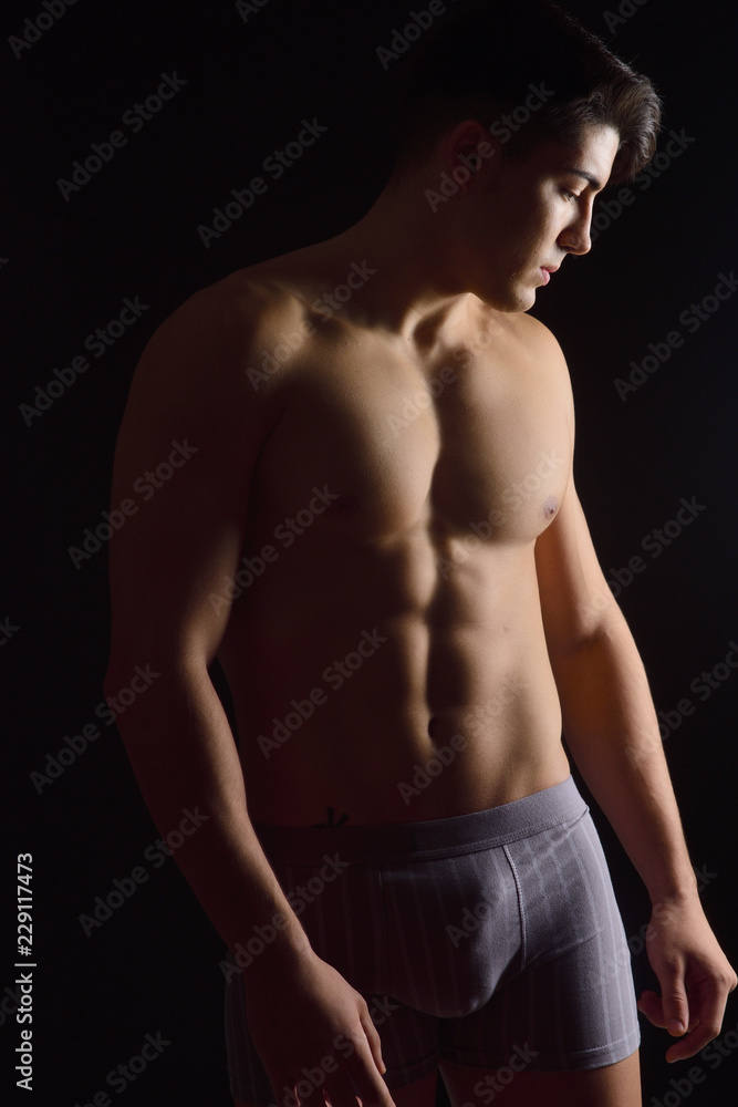 Fototapeta premium portrait of a man without clothes black background