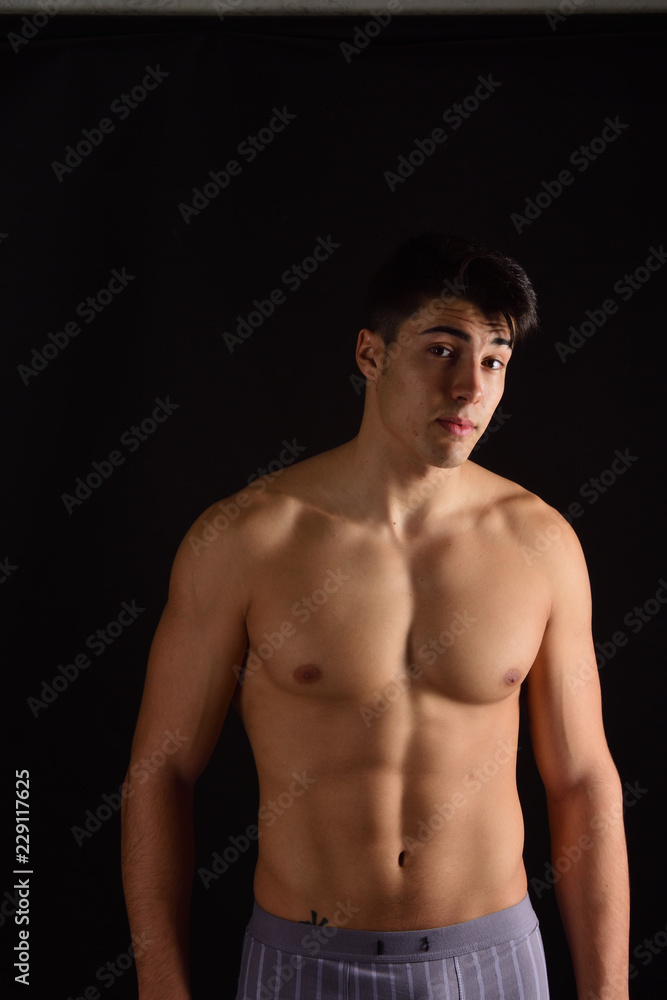 portrait of a man without clothes black background