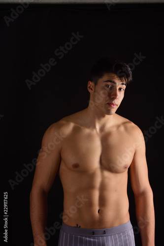 portrait of a man without clothes black background © curto
