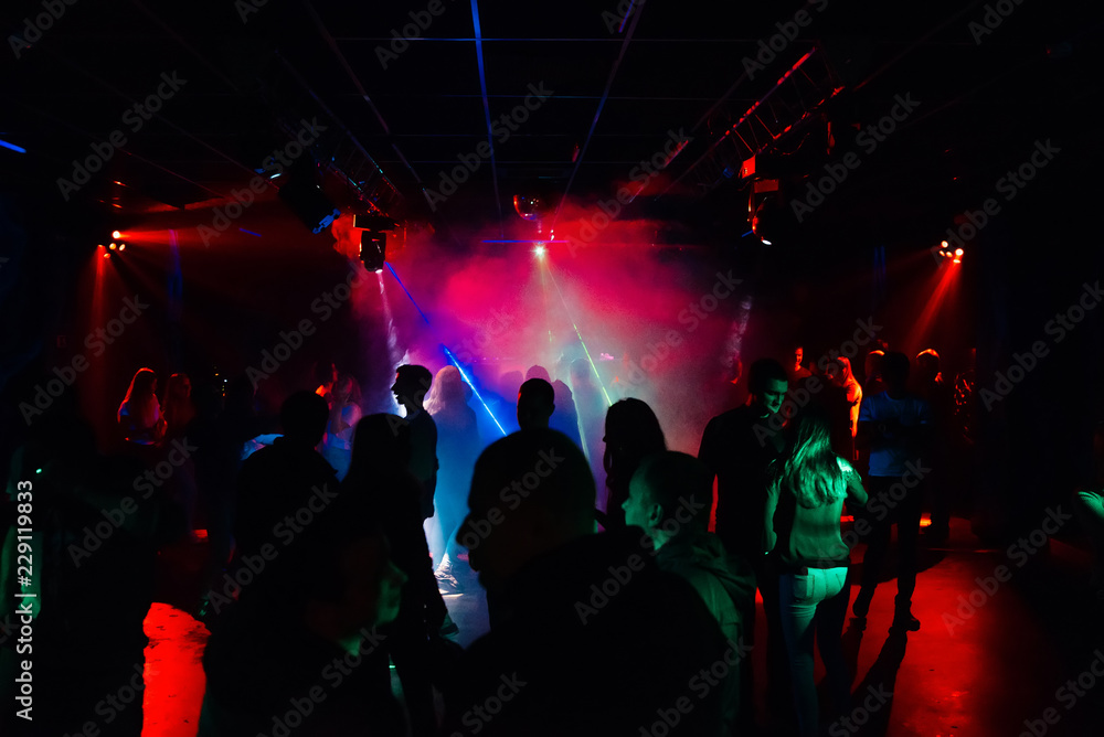 people dancing in a nightclub on the dance floor at a party
