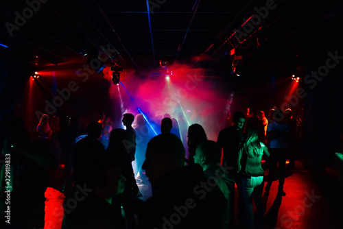people dancing in a nightclub on the dance floor at a party © alexkoral