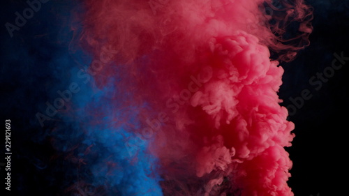 pink and blue bomb smoke on black background