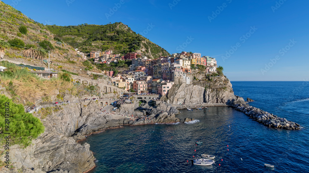 Panoramic view of Manarola illuminated by the late afternoon sun, Cinque Terre, Liguria, Italy