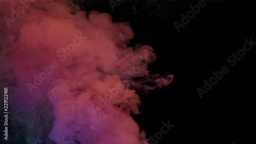 yellow and pink bomb smoke on black background