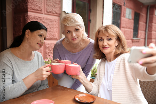 Beautiful mature women drin...