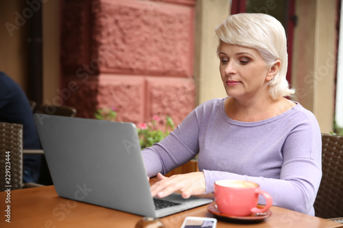 Beautiful mature woman work...