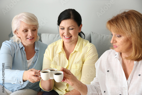 Beautiful mature women drin...