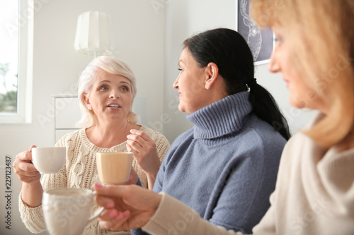 Beautiful mature women drin...
