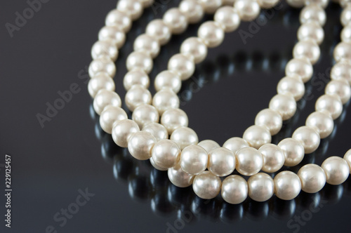 pearls necklace on black background
