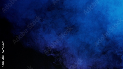 blue bomb smoke on black background