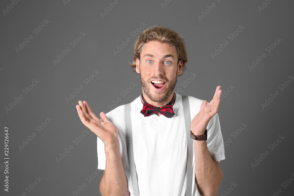 Portrait of handsome surprised man on grey background Portrait of handsome surprised man on grey background