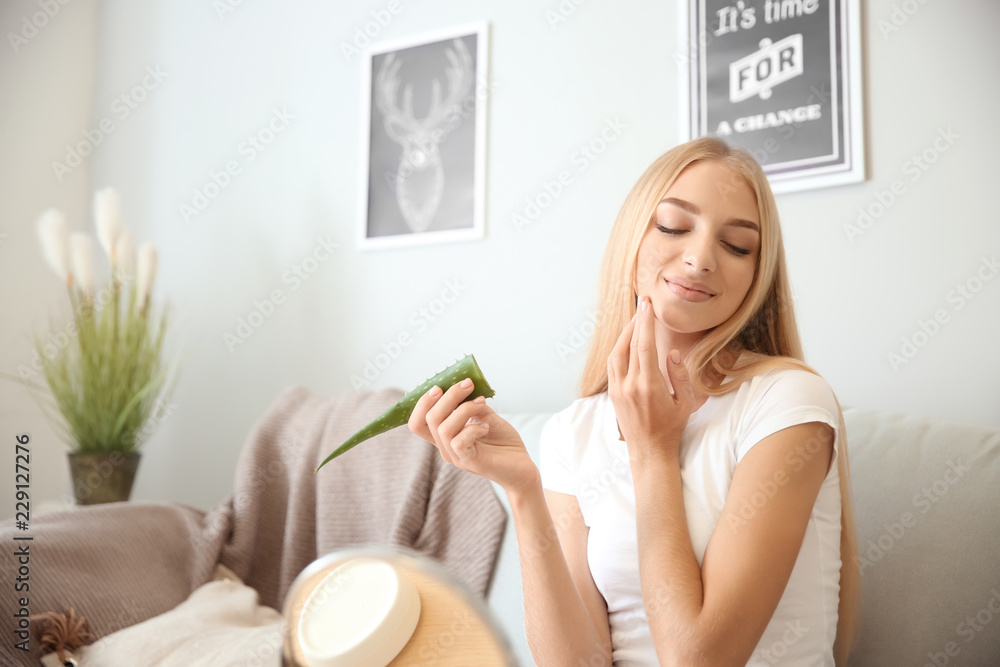 Beautiful young woman using aloe vera at home Beautiful young woman using aloe vera at home