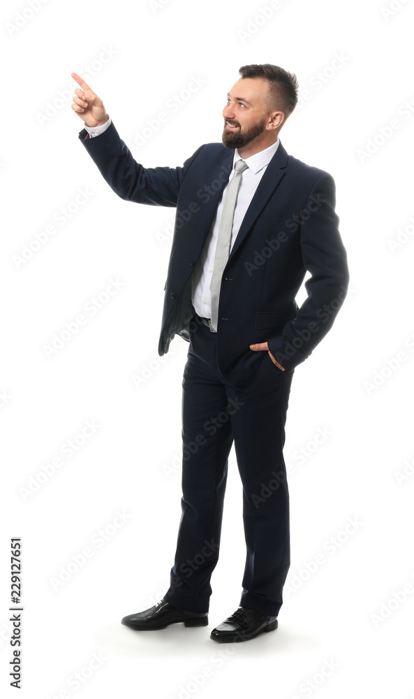 Handsome businessman pointing at something on white background Handsome businessman pointing at something on white background