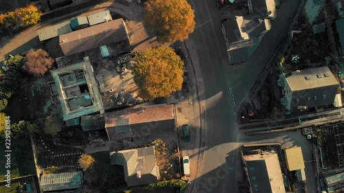 Drone pan over a small village in the Peak District, England - Taken in Early Autumn 2018 showing the narrow streets and yellow trees