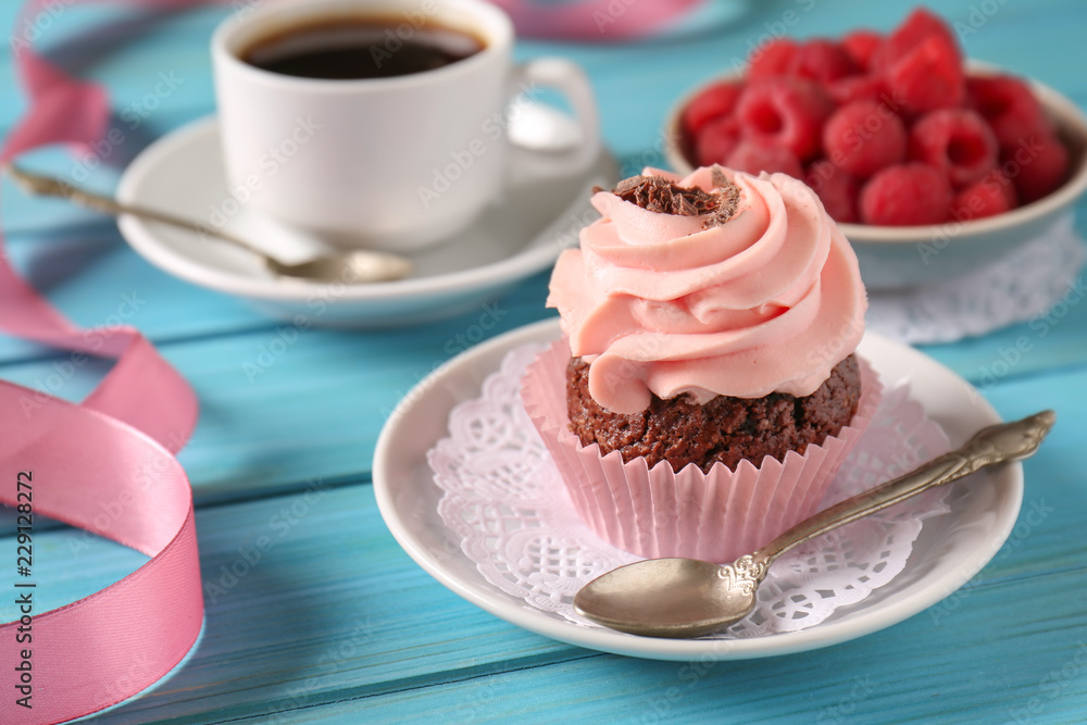 Sweet tasty cupcake on color wooden background Sweet tasty cupcake on color wooden background