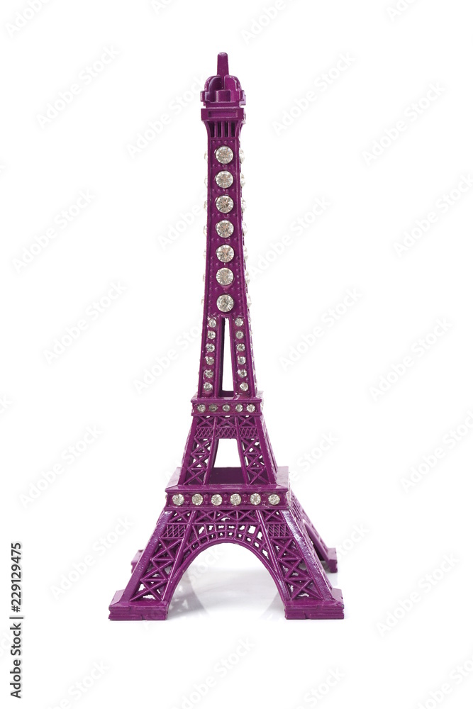 purple Eiffel tower statue isolated on white background