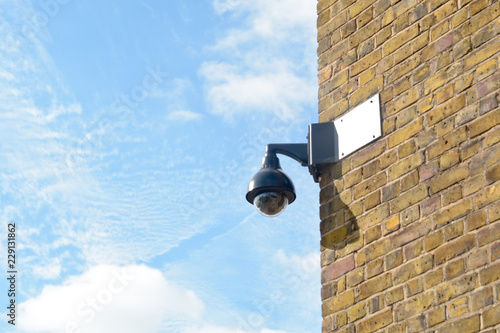 Surveillance camera on wall in London - the city with the most surveillance cameras in the world, London, England