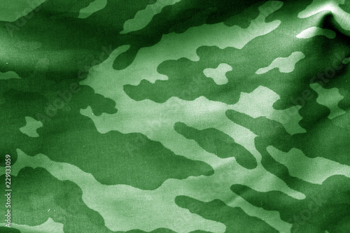 Camouflage cloth with blur effect in green tone.