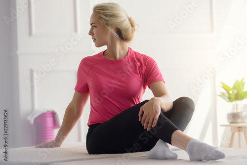 young woman doing fitness exercise at home