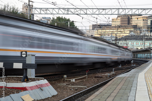 Train on Moscow passenger platform at night (Belorussky railway station) -- Moscow, Russia.  photo