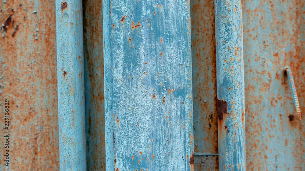 Rusty texture on a metal container that is on the street all year round.