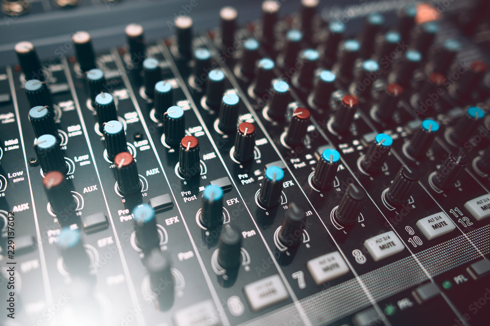 Equalizer console. Digital sound audio mixer closeup . Studio music recording equipment.