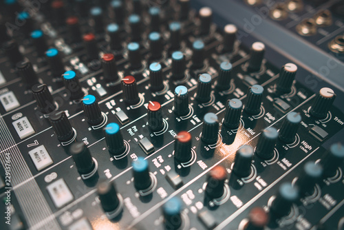 Equalizer console. Digital sound audio mixer closeup . Studio music recording equipment.