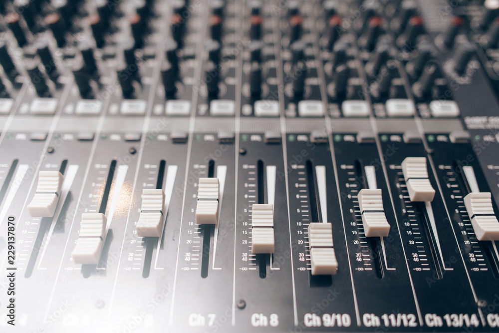Audio equalizer close up. Studio audio volume mixer. Professional audio equipment. Audio equalizer close up. Studio audio volume mixer. Professional audio equipment.