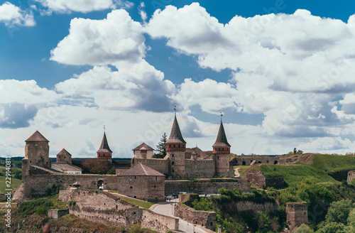 Landscape summer sunny view and blue sky with clouds on the fortress and the old town in Kamenetz Podolsky. Ukraine. photo