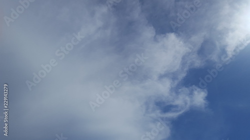 Blue skies with clouds in a clear day, in the morning. 