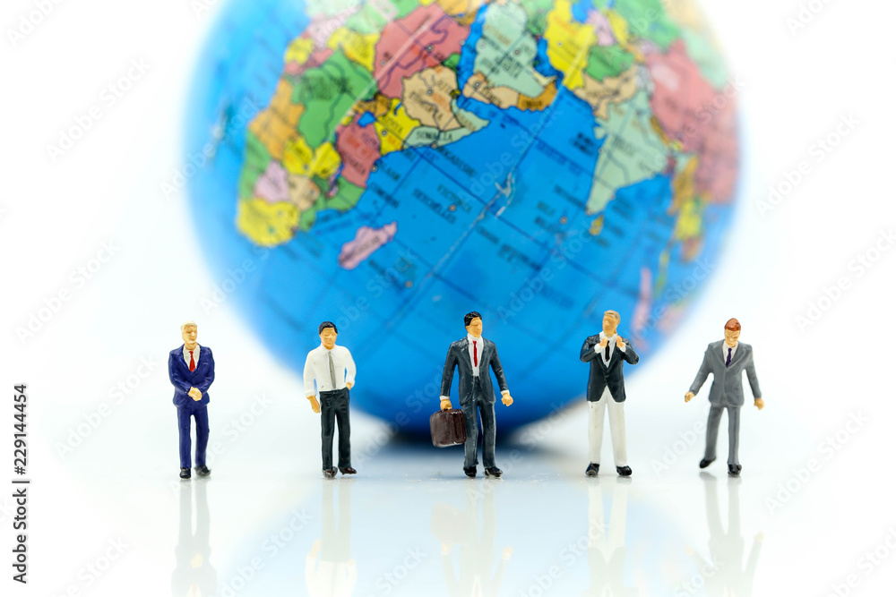 Miniature people : Businessman with mini world using for concept of International Men's Day. Miniature people : Businessman with mini world using for concept of International Men's Day.