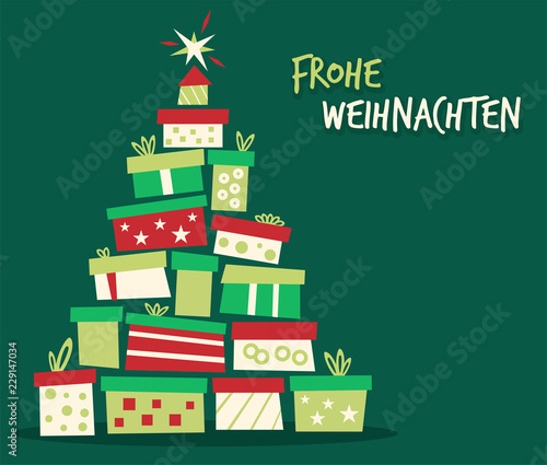 Weihnachtsbaum aus Geschenken Frohe Weihnachten gruener Hintergrund