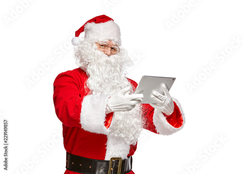 Santa Claus using tablet computer. © k_e_n