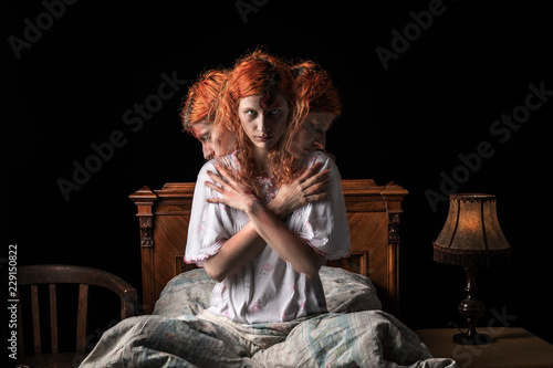 Photo Scary woman possessed by devil in the bed