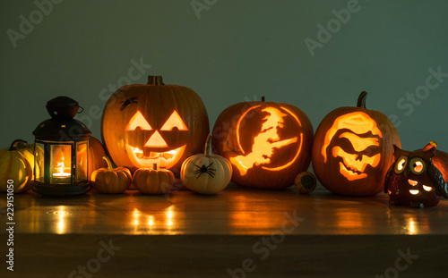 Halloween decorated pumpkins with candles and a lantern