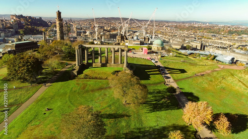 Aerial image over the monuments on Calton Hill in Edinburgh to the Castle on a bright Autumn day.