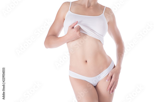 Female cropped fit body in white panties and top, isolated on white.