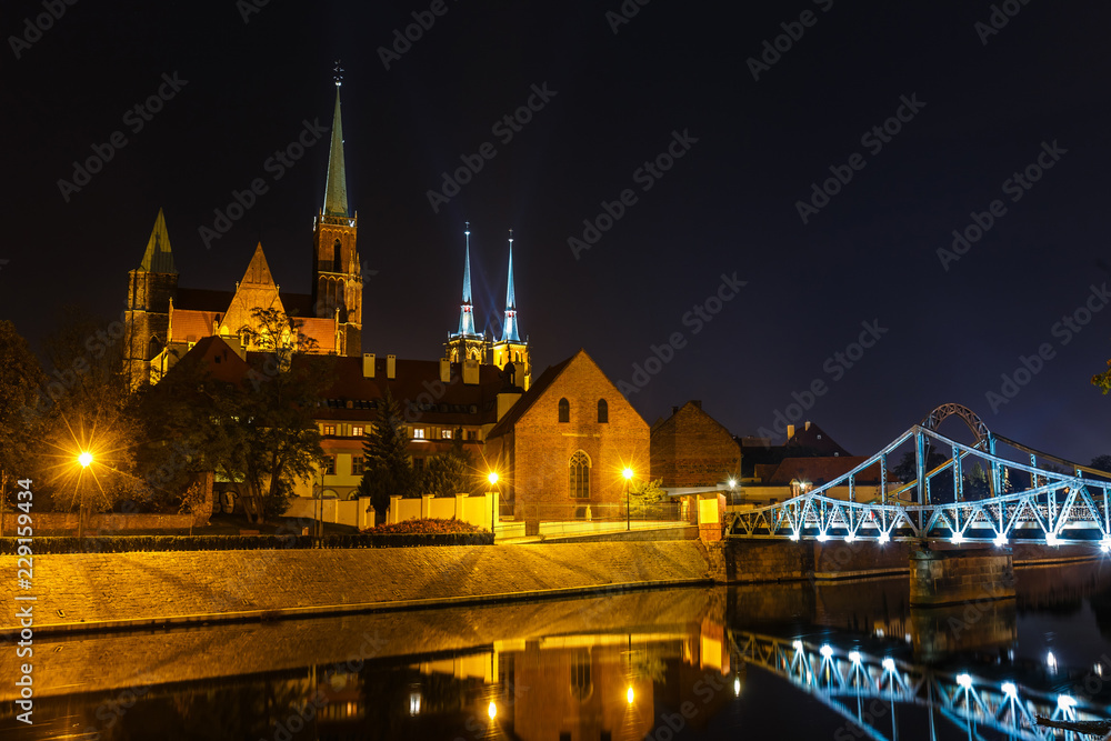 Night view of church of the Holy Cross and St Bartholomew and cathedral of saint john the baptist in Wroclaw, Poland