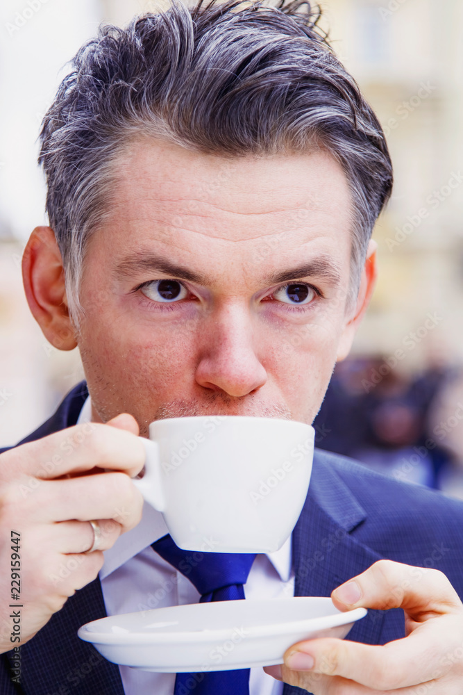 Coffee Break. Sucessful businessman enjoying in a cup of coffee Coffee Break. Sucessful businessman enjoying in a cup of coffee